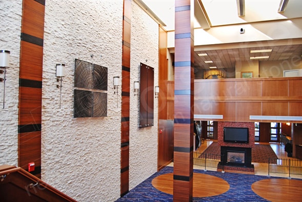 Three Story Hotel Lobby Atrium Stacked Stone Feature Wal